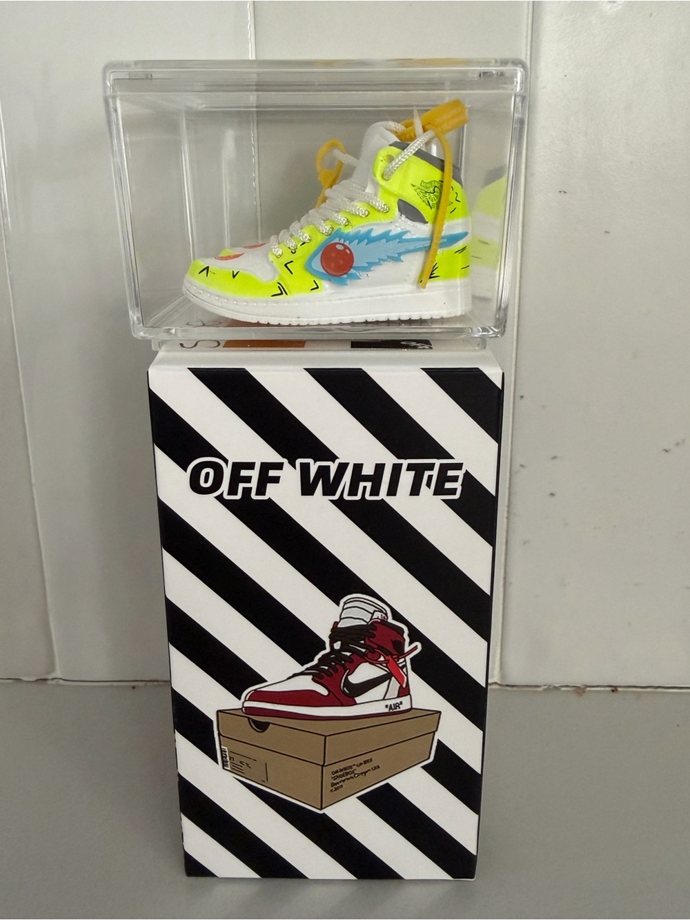 Off-White Neon Yellow and White High-Top Collector Sneaker with Blue Accent